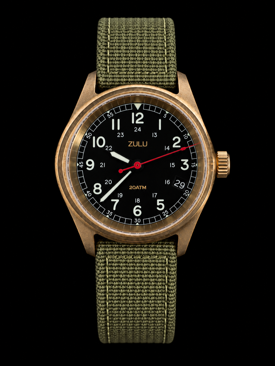 A wristwatch with a bronze-toned metal case, a black dial featuring white Arabic numerals and a red second hand, and an olive green woven fabric strap, shown against a solid black background.
