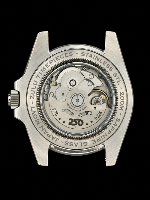 The back case of a wristwatch with a transparent sapphire glass window, revealing the intricate mechanical movement inside. The stainless steel case is engraved with ZULU TIMEPIECES - STAINLESS STEEL - 200M - JAPAN - SAPPHIRE GLASS - 250 and features a crown adjustment on the left.