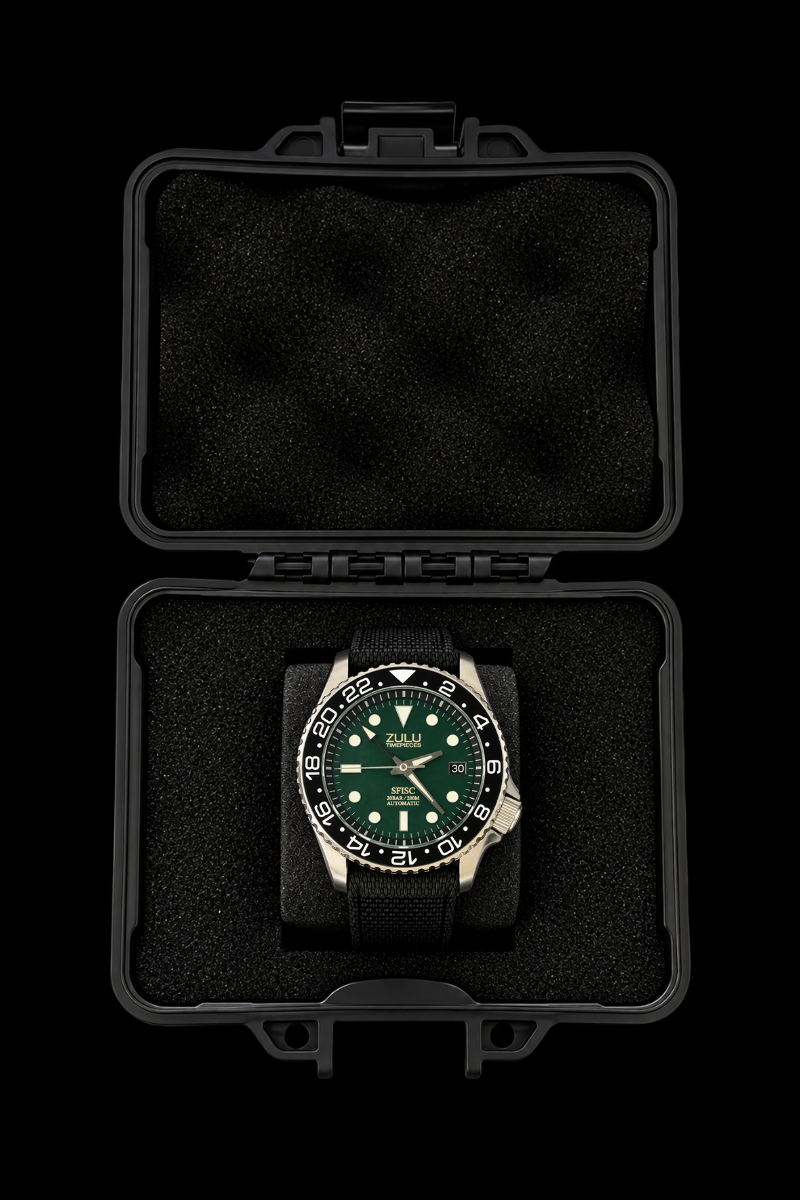 A wristwatch with a green dial and black bezel, displayed inside an open black protective case on a black background.